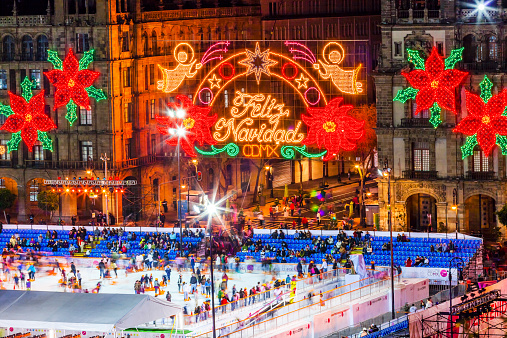 Mexico City, Mexico - December 25, 2014: Mexico City Zocalo Christmas Night Celebration Ice Skating Rink,  Feliz Navidad is Spanish for Merry Christmas.