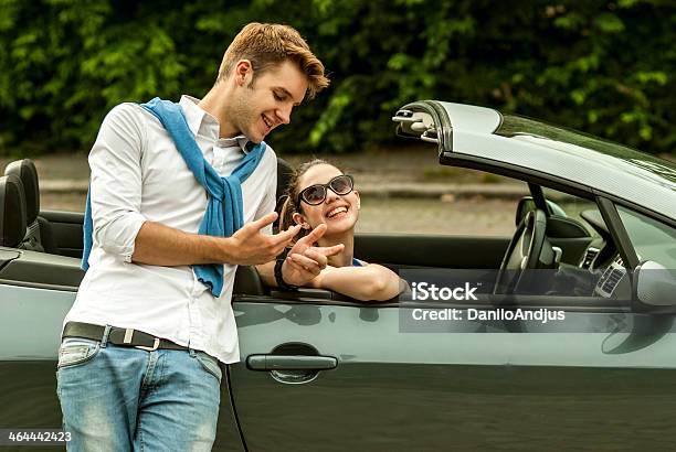 Cheerful Couple Talking Stock Photo - Download Image Now - Belt, Blond Hair, Cardigan Sweater