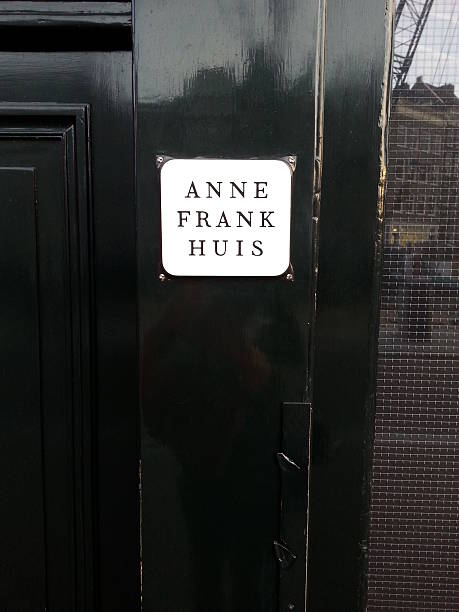 Amsterdam, Netherlands - December 16, 2013: Nameplate on the house where Anne Frank lived during World War II. Today the house in Amsterdam serves as a museum.