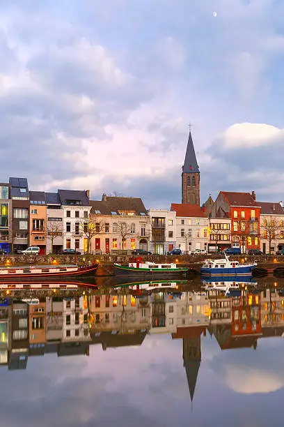 Photo of Embankment of the river Leie in Ghent town at sunset