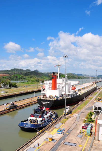 Panama Canal, Panama - January 26, 2009: freighter ship entering the Panama canal at the Miraflores locks outside Panama City