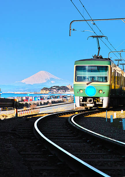 Coastal Landscapes Kamakura Route 137 and Enoshima Electric Railway which runs in parallel to the Kamakura of coastline. Background Mount Fuji. kamakura city photos stock pictures, royalty-free photos & images