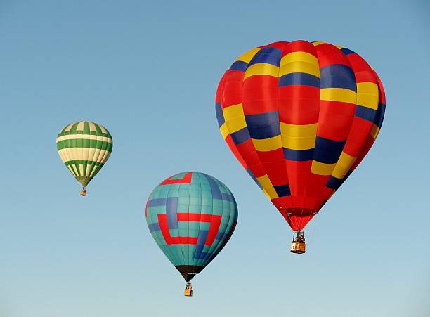 istock Three hot air balloons in blue sky 464447076