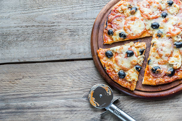 istock Cooked pizza on the wooden board 464447364