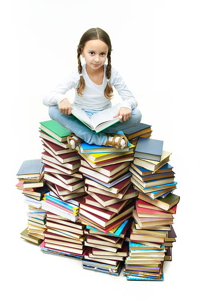 istock Girl on books 464448432