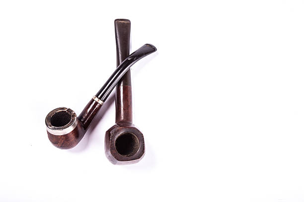 Old wooden tobacco pipe isolated on white backgroundOld wooden tobacco pipes isolated on white background