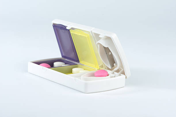 istock Pill box and aluminum split blade show medicine concept 464449550