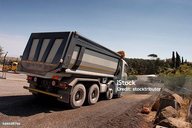 Truck And Bulldozer Work In The Quarry Stock Photo - Download Image Now - 2015, Adult, Agricultural Machinery