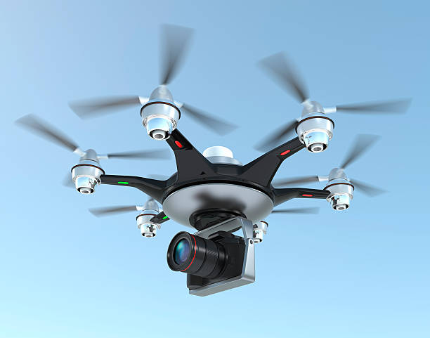 istock A drone flying high with a camera mounted to take pictures 464450096