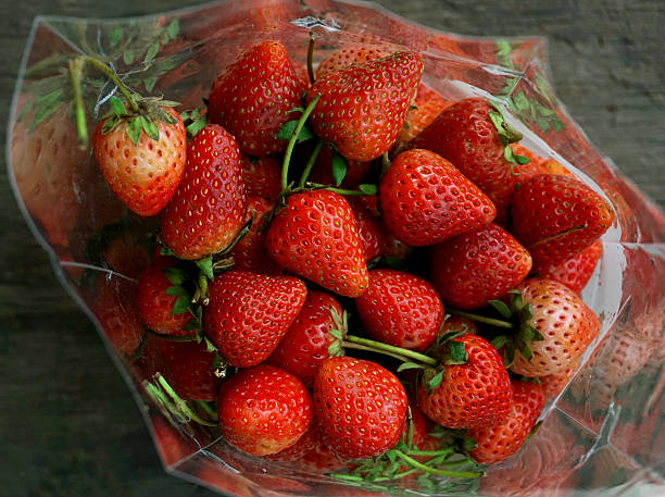 istock strawberry in clear bag 464450354