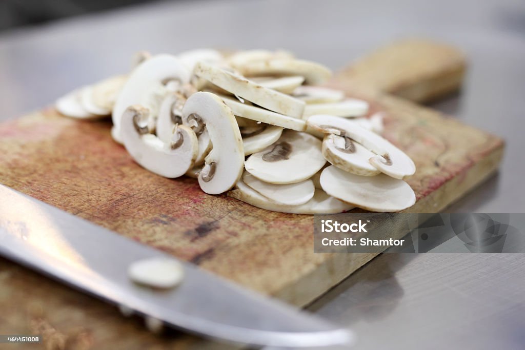 Mushroom mushroom cutted White Champignon mushroom just cutted on a kitchen table 2015 Stock Photo