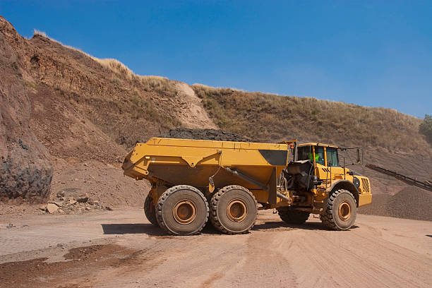 istock Truck and bulldozer work in the quarry 464451364