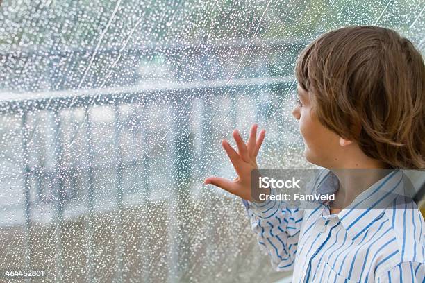 Boy Watching Rain Stock Photo - Download Image Now - Boys, Bridge - Built Structure, Child