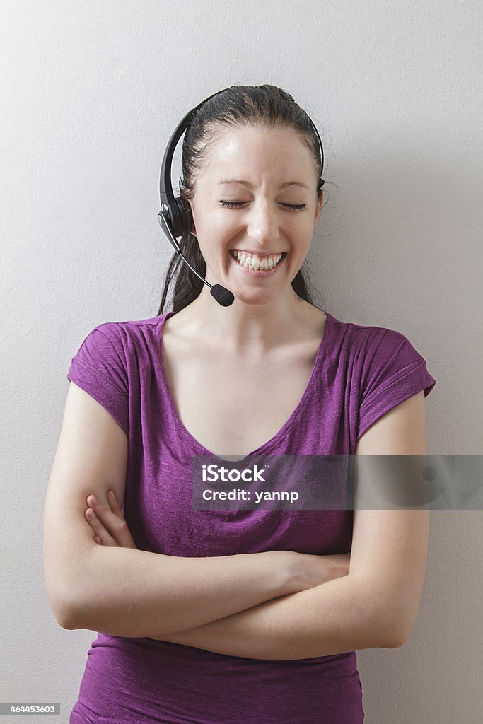 laughing agent twenty something female phone agent laughing on the phone 20-29 Years Stock Photo