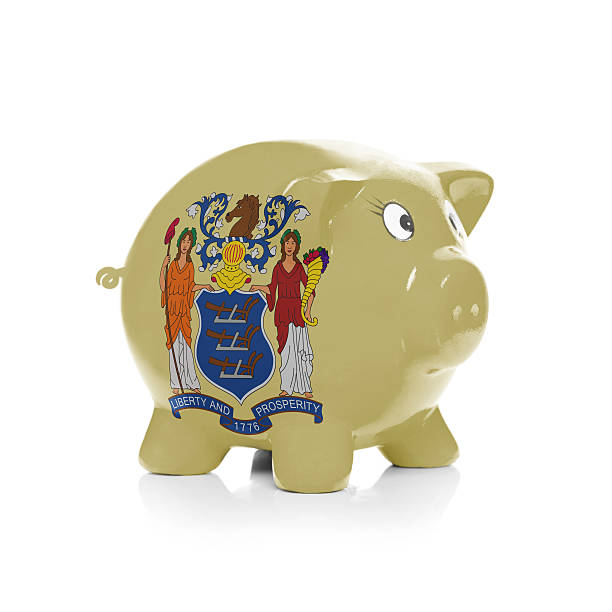 Piggy bank with flag - State of New Jersey Piggy bank with flag coating over it isolated on white - State of New Jersey jerseyan stock pictures, royalty-free photos & images