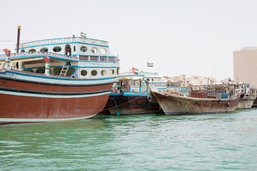 Traditional Dhows, corgo carrying boats, moored at Dubai Creek, United Arab Emirates