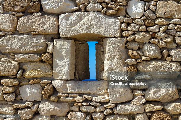 Loophole In The Wall Of An Ancient Fortress Stock Photo - Download Image Now - 2015, Abstract, Ancient