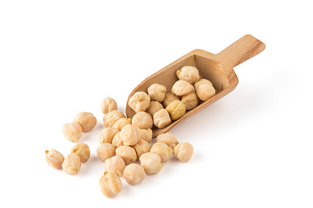 Dried chickpeas and a wooden scoop Chickpea With Scoop chick pea photos stock pictures, royalty-free photos & images