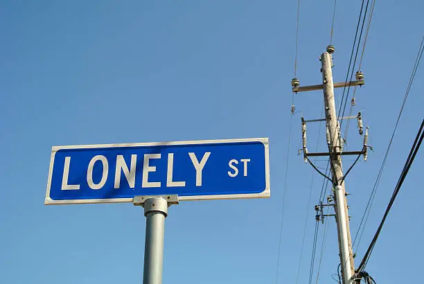 'Lonely Street' blue street sign at Elvis Presley museum in Graceland, Memphis, Tennessee.