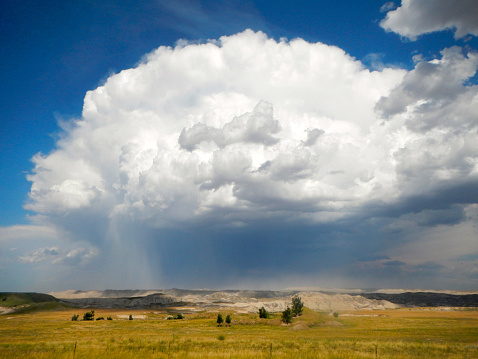 large white clouds evolving over the South Unit of the Badlands, Pine Ridge Indian Reservation, South Dakota, USA