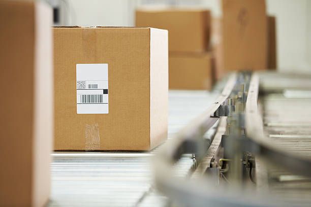 istock Goods On Conveyor Belt In Distribution Warehouse 464458545