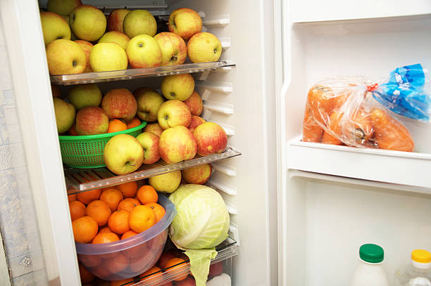 istock raw fruits in the fridge 464460216