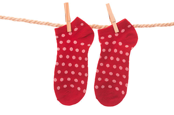 istock red socks hanging on a rope clothesline 464461382