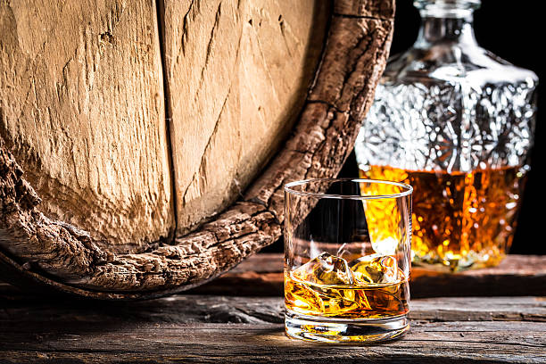 istock Glass of aged whisky with ice 464462354