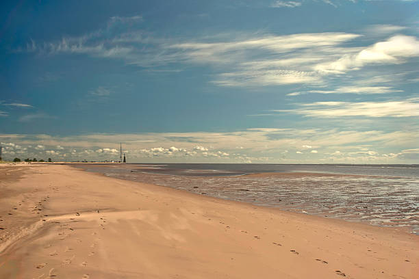 istock Calm sea coast with footprints 464464932