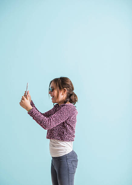 istock Laughing girl reading funny text message 464467114