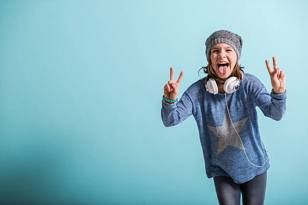 istock Cheaky girl giving victory sign 464467262