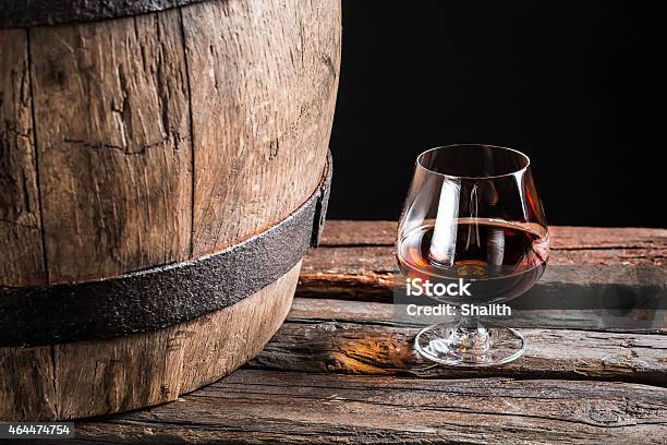 Brendy Glass And Old Wooden Barrel Stock Photo - Download Image Now - 2015, Aging Process, Alcohol - Drink