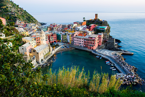 Vernazza, sunset from a hill over the beautiful town in the ligurian sea coast, Italy