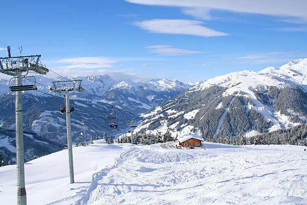 istock Chairlift and mountains with ski hut 464480514