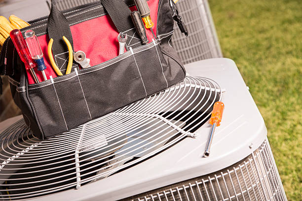 Service Industry:  Work tools on air conditioners. Outside home. stock photo