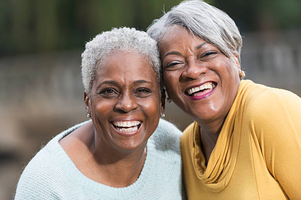 istock Faces of two senior friends 464482196