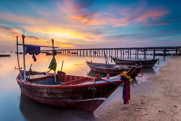 istock sunset on the sea with a boat 464486620