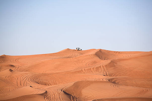 istock Desert dunes, an off-road vehicle 464487076
