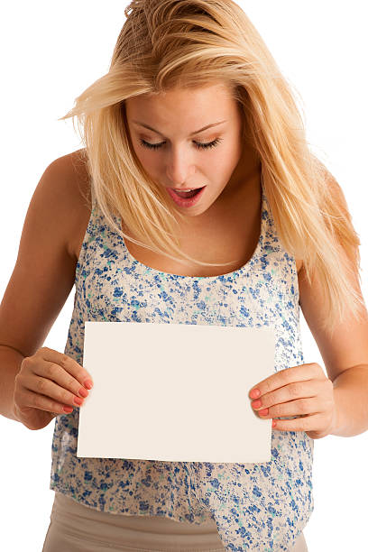 istock woman holding a blank whiteboard 464487180