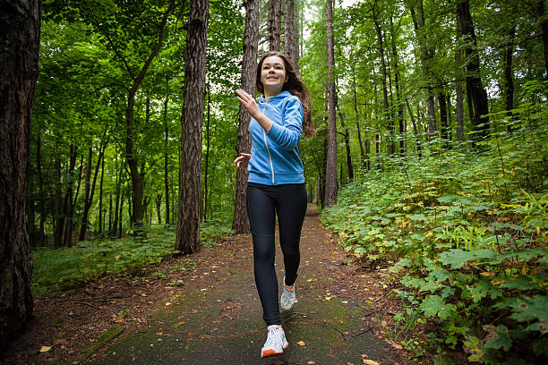 istock Young woman running outdoor 464490294