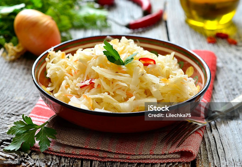 Sour cabbage,traditional dish of russian cuisine. Sour cabbage in a ceramic bowl,traditional dish of russian cuisine. 2015 Stock Photo