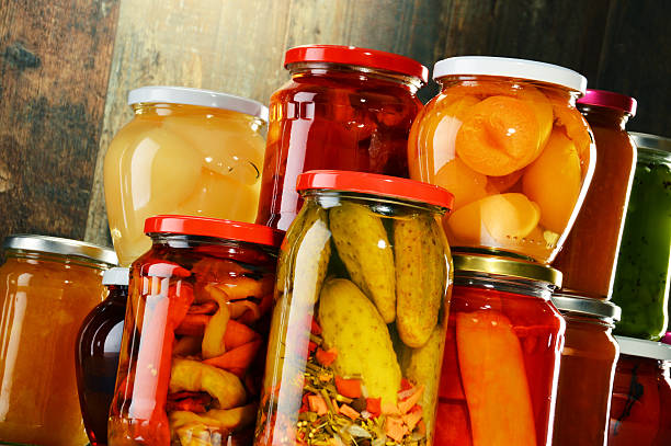istock Jars with pickled vegetables, fruity compotes and jams isolated 464491216