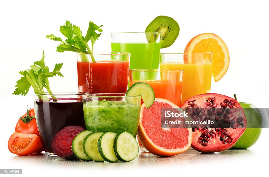 Glasses with fresh organic vegetable and fruit juices on white Glasses with fresh organic vegetable and fruit juices isolated on white. Detox diet. 2015 Stock Photo