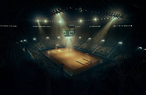 Basketball arena Indoor floodlit basketball arena full of spectators - full 3D scoreboard stock pictures, royalty-free photos & images