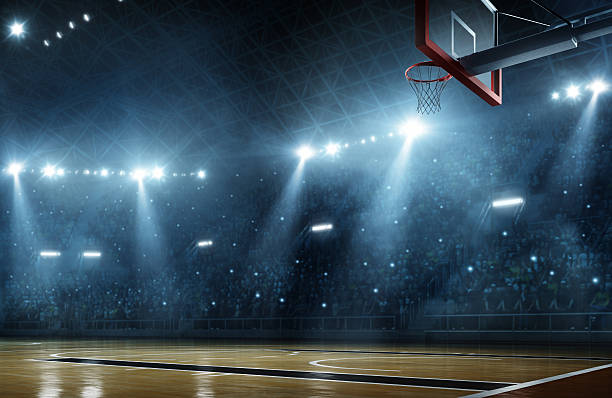 Basketball arena Indoor floodlit basketball arena full of spectators - full 3D basketball sport stock pictures, royalty-free photos & images