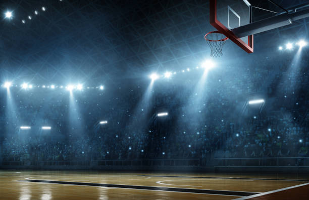 Basketball arena Indoor floodlit basketball arena full of spectators - full 3D sports court stock pictures, royalty-free photos & images