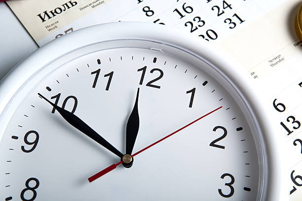 istock sheet of a calendar with clockface 464492776