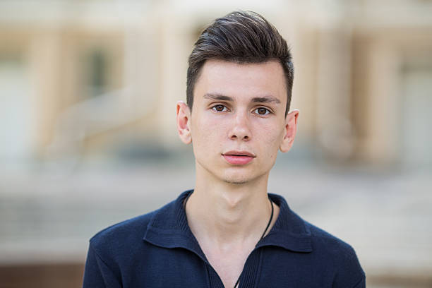 istock Handsome sad young guy portrait outside 464494191