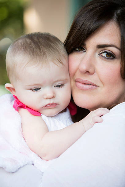istock woman with baby 464494292