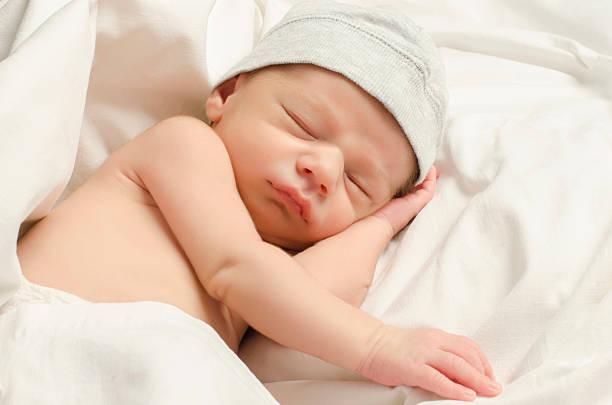 istock New born baby boy sleeping. 464496506